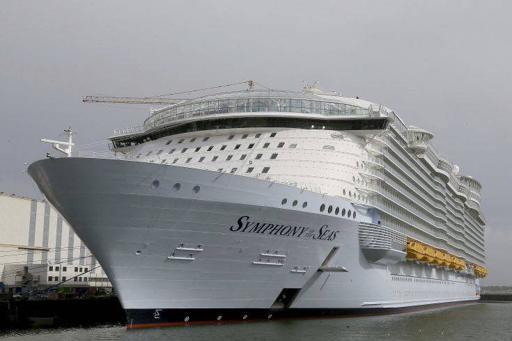 The Symphony of the Seas docks at Saint Nazaire port, western France, Friday, March 23, 2018. Royal Caribbean International took delivery of the much-awaited, 228,081-ton Symphony of the Seas from the French shipyard STX. Harmony of the Seas is the world's largest cruise ship. (AP Photo/David Vincent)