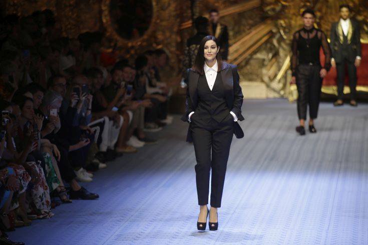 Actress Monica Bellucci wears a creation as part of Dolce & Gabbana's 2019 Spring-Summer collection, unveiled during the Fashion Week in Milan, Italy, Saturday, June 16, 2018. (AP Photo/Luca Bruno)